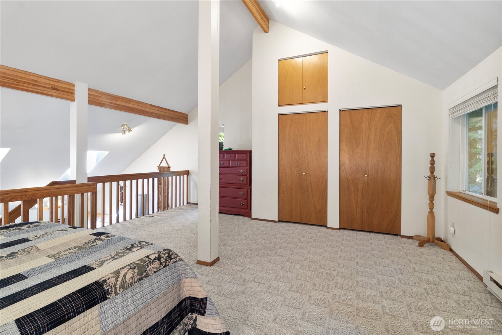 7036 Rainier Way Glacier, WA 98244 - Photo 22 of 31 a view of a bedroom with wooden floor and windows