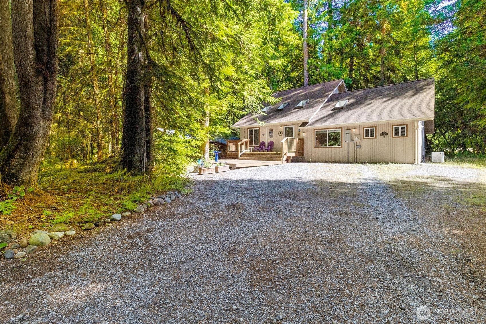 7036 Rainier Way Glacier, WA 98244 - Photo 23 of 31 a big house with large trees and wooden fence