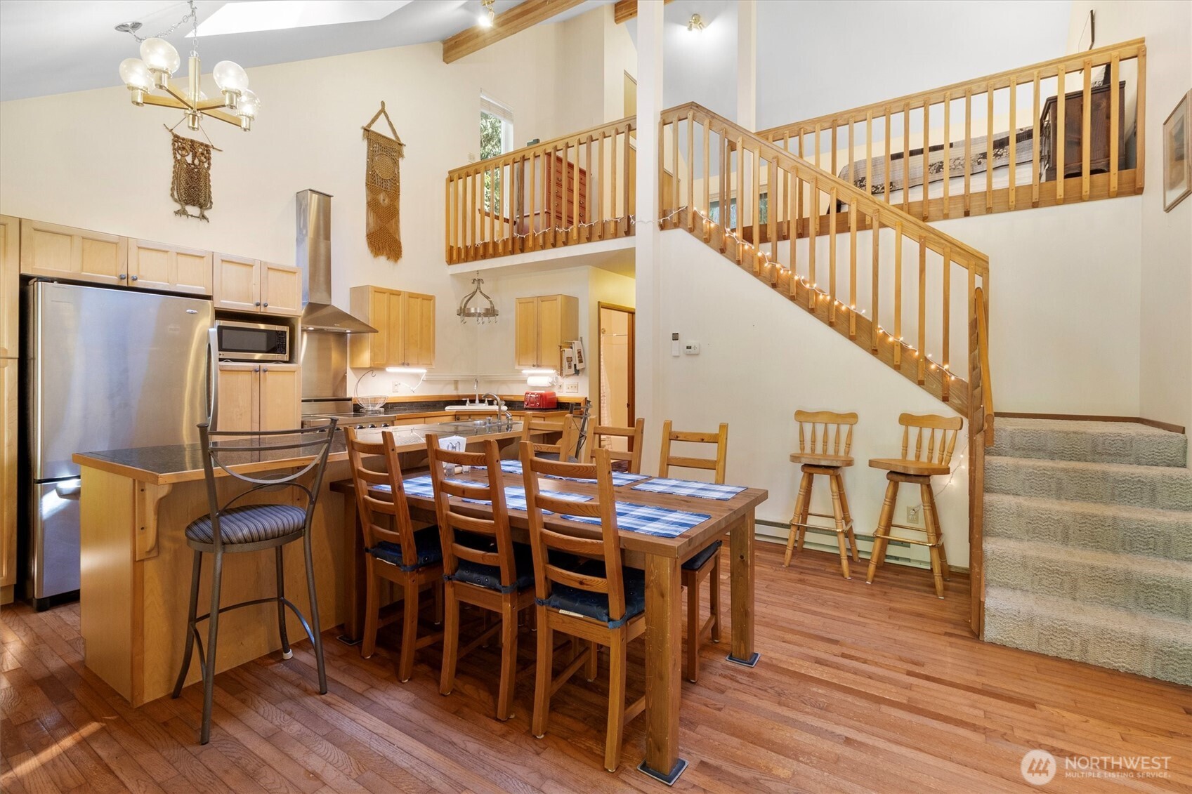 7036 Rainier Way Glacier, WA 98244 - Photo 6 of 31 a view of a dining room with furniture and wooden floor
