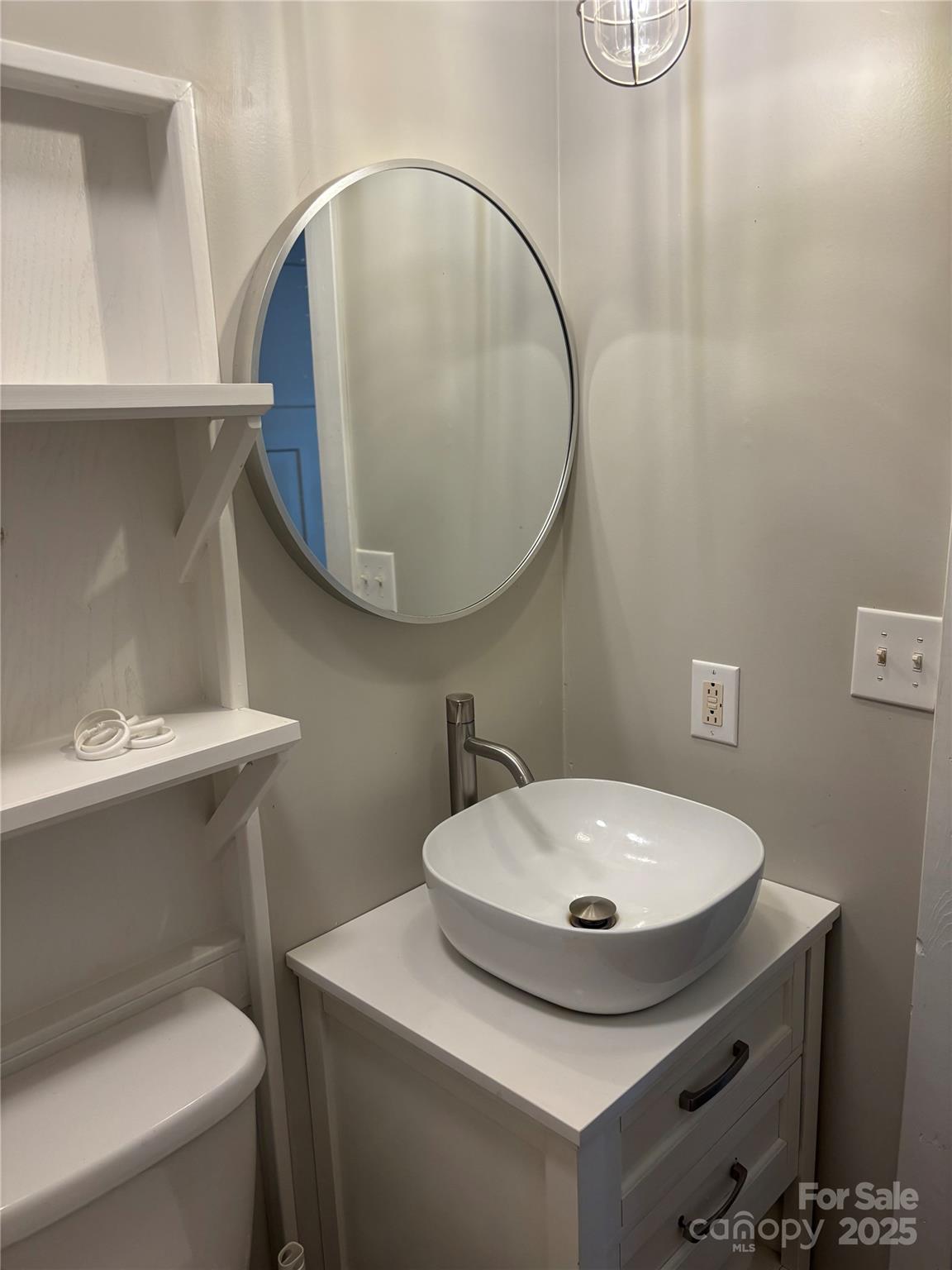 1042 Bart Thurman Road Mount Croghan, SC 29727 - Photo 11 of 16 a bathroom with a sink mirror and toilet