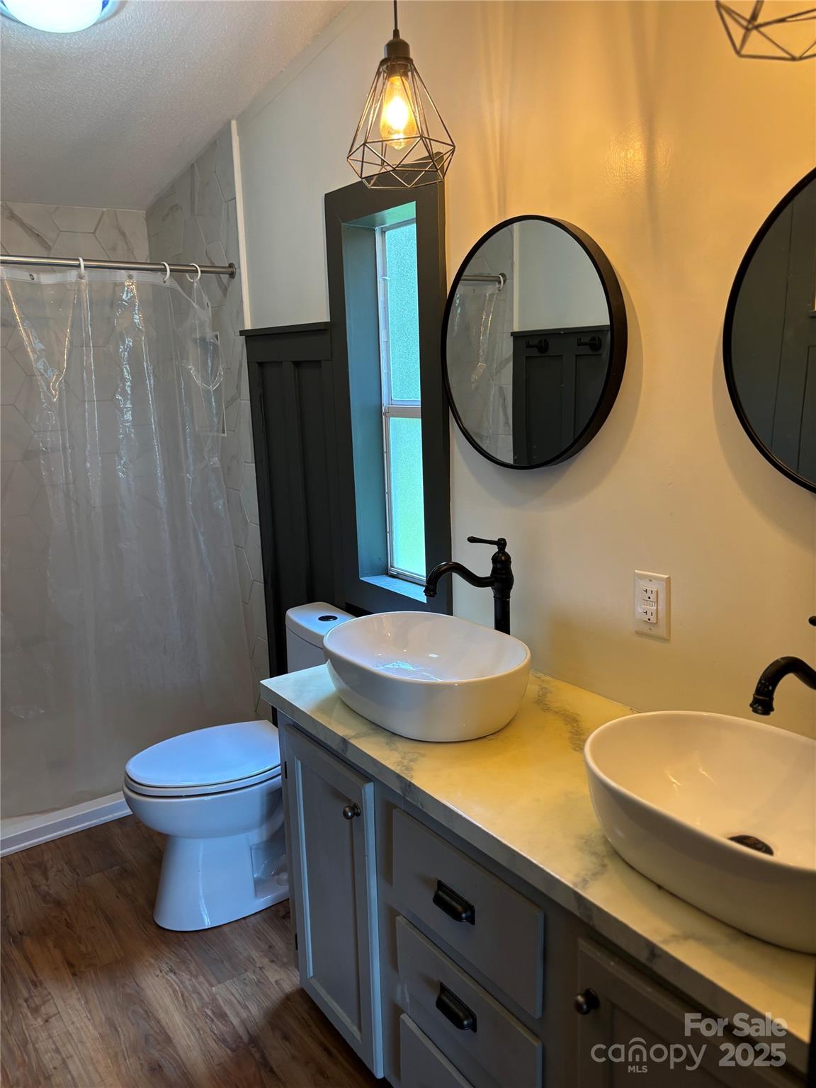 1042 Bart Thurman Road Mount Croghan, SC 29727 - Photo 16 of 16 a bathroom with a sink and a mirror