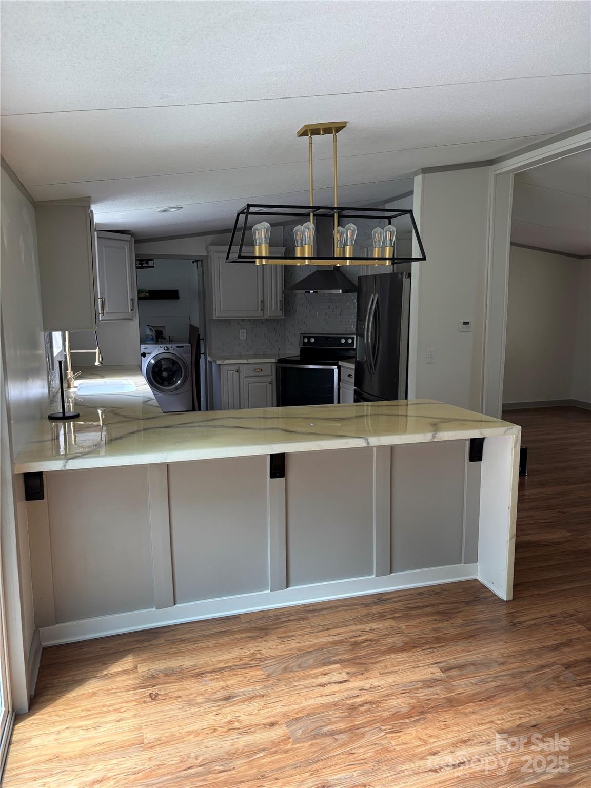 1042 Bart Thurman Road Mount Croghan, SC 29727 - Photo 7 of 16 a kitchen with stainless steel appliances a sink and stove