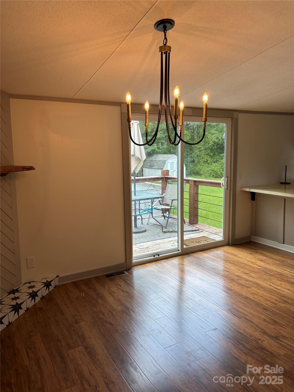1042 Bart Thurman Road Mount Croghan, SC 29727 - Photo 9 of 16 a view of empty room with wooden floor and a window