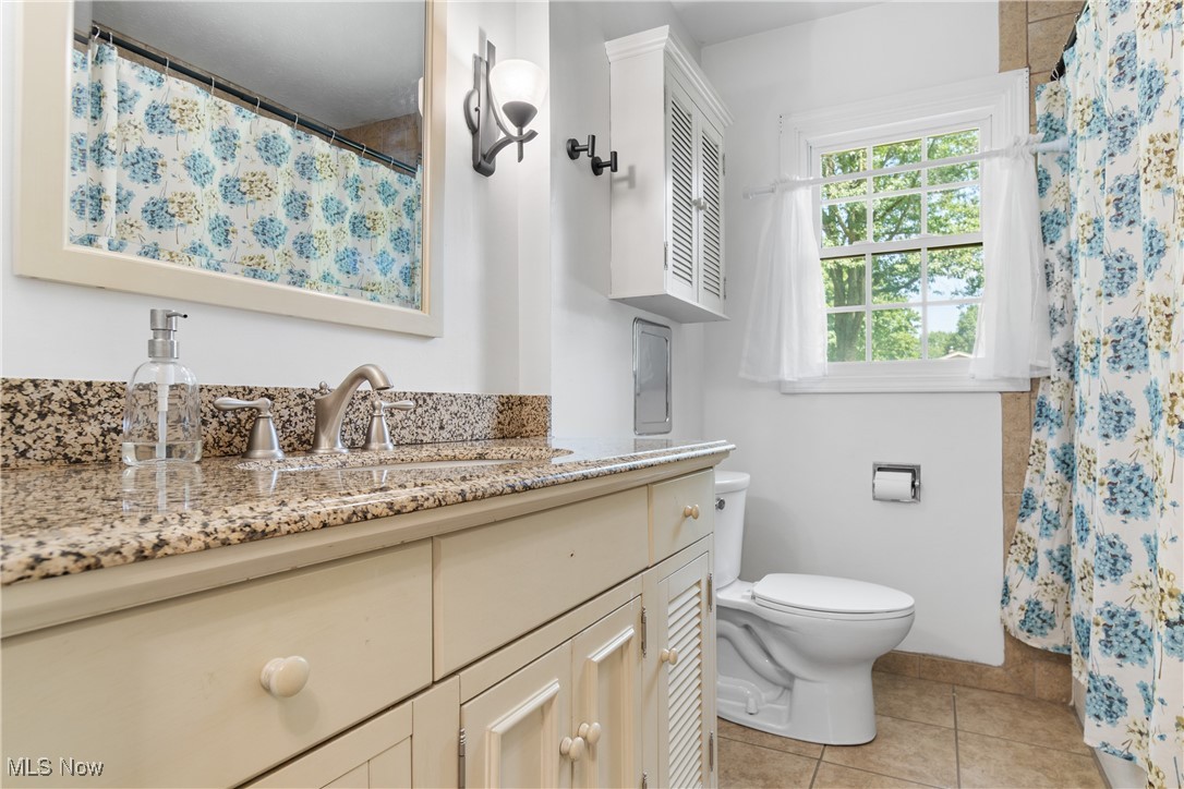 4401 Conestoga Trail Akron, OH 44321 - Photo 22 of 35 Bathroom with tile patterned floors and vanity