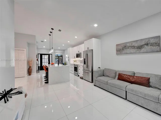 a living room with furniture and a table