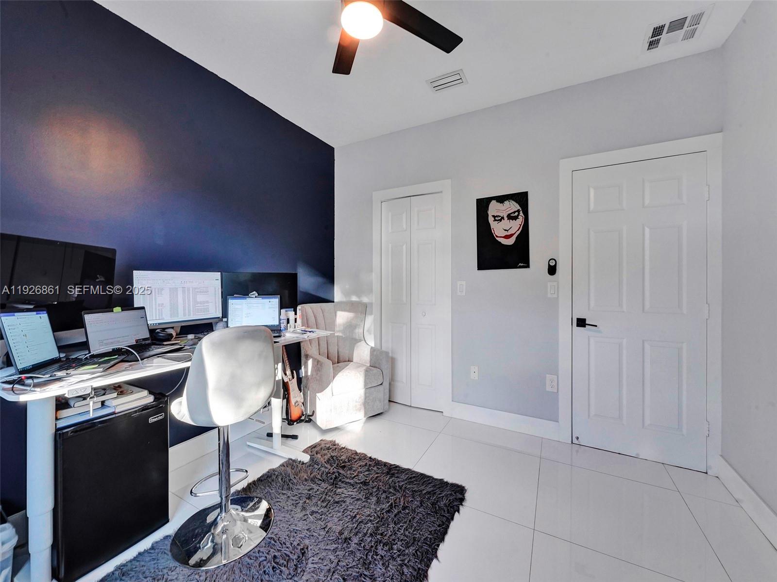 19901 Northwest 77th Court Hialeah, FL 33015 - Photo 23 of 50 a workspace with furniture and screen