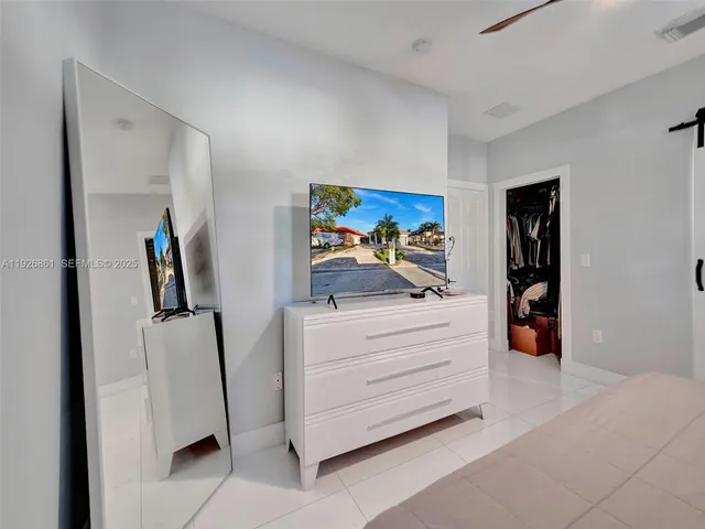 a view of living room with cabinets and furniture