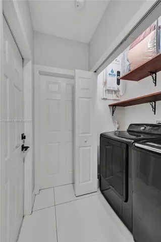 a kitchen with stainless steel appliances granite countertop a stove and a refrigerator