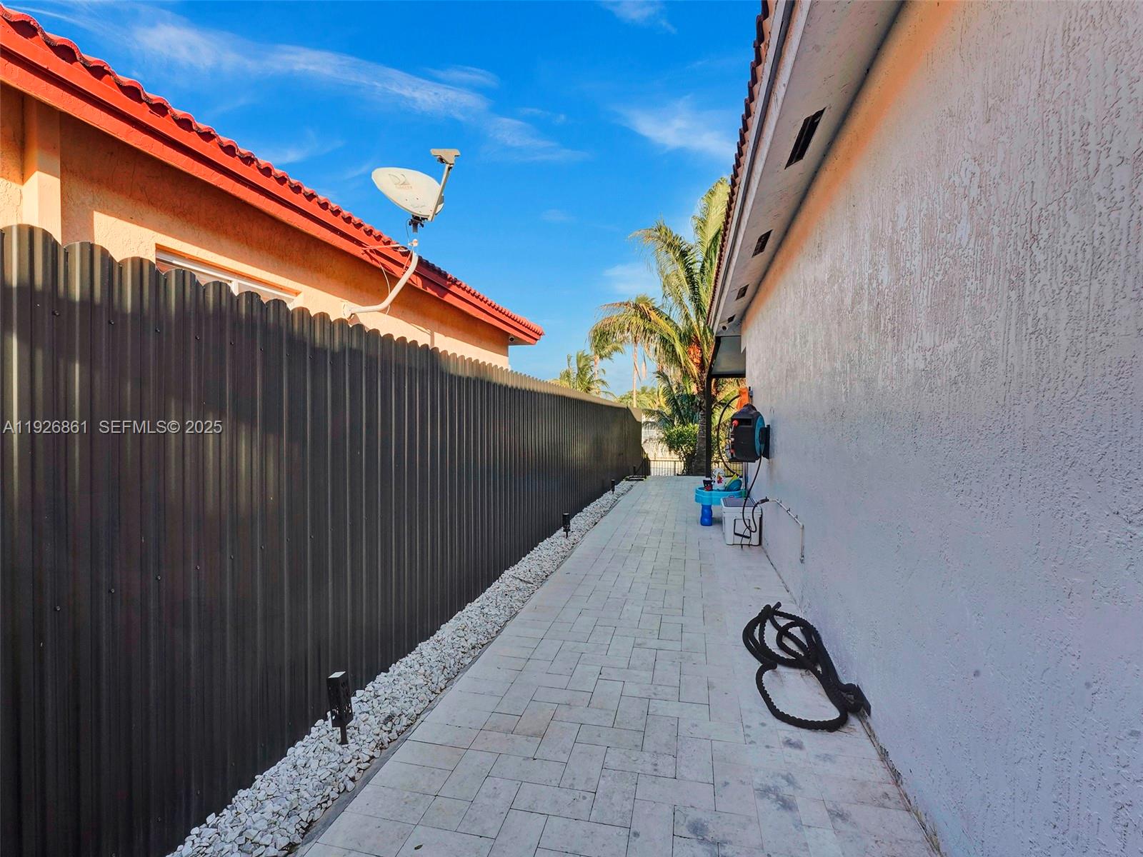 19901 Northwest 77th Court Hialeah, FL 33015 - Photo 36 of 50 a view of a backyard with a door