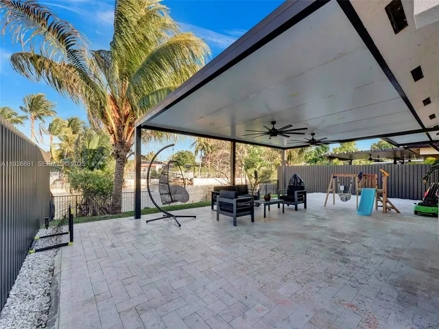a view of outdoor space with table and chairs