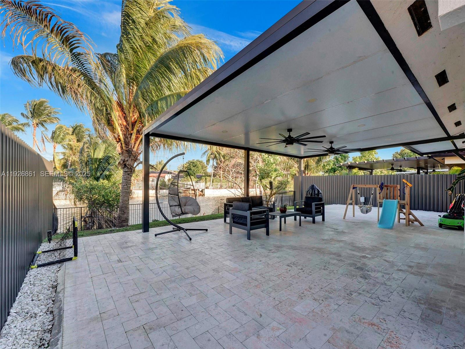 19901 Northwest 77th Court Hialeah, FL 33015 - Photo 38 of 50 a view of outdoor space with table and chairs