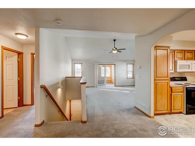 a view of washer and dryer with kitchen in the background