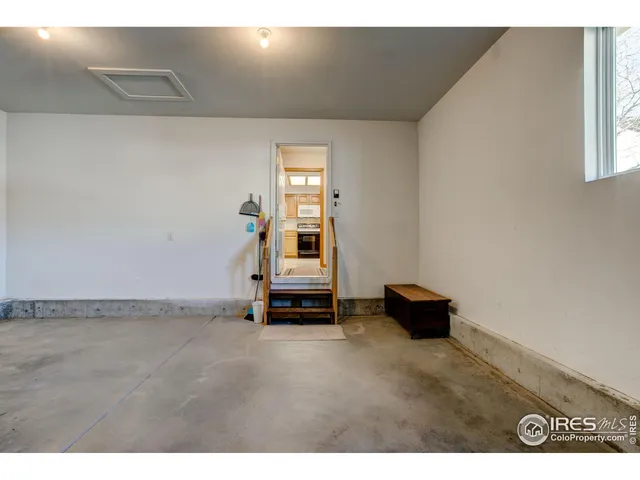 a view of outdoor space walk in closet and wooden floor