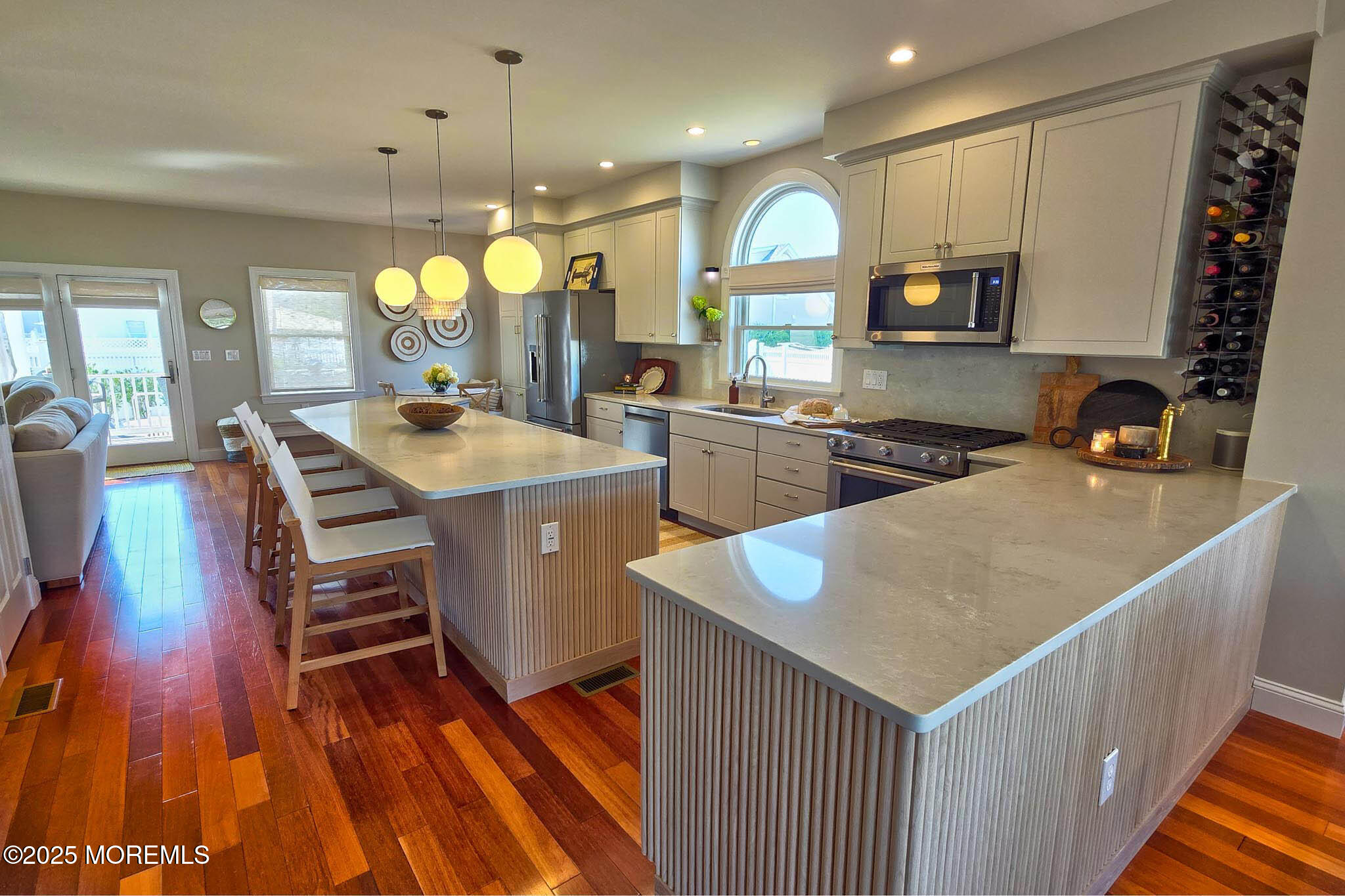 1604 Baltimore Avenue Lavallette, NJ 08735 - Photo 19 of 76 a kitchen with stainless steel appliances granite countertop a sink a stove and a wooden floors