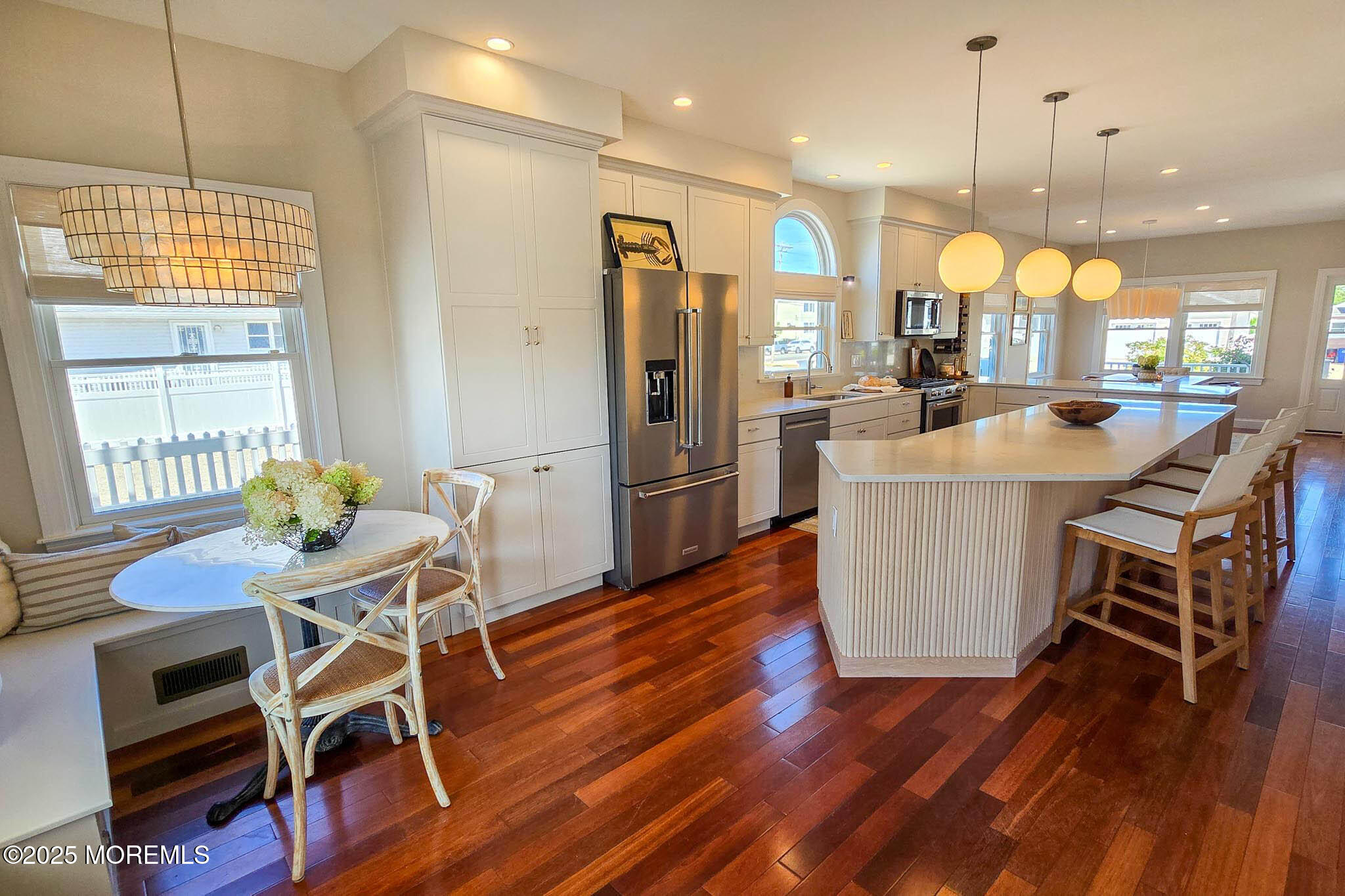 1604 Baltimore Avenue Lavallette, NJ 08735 - Photo 22 of 76 a kitchen with stainless steel appliances granite countertop a kitchen island hardwood floor and a sink