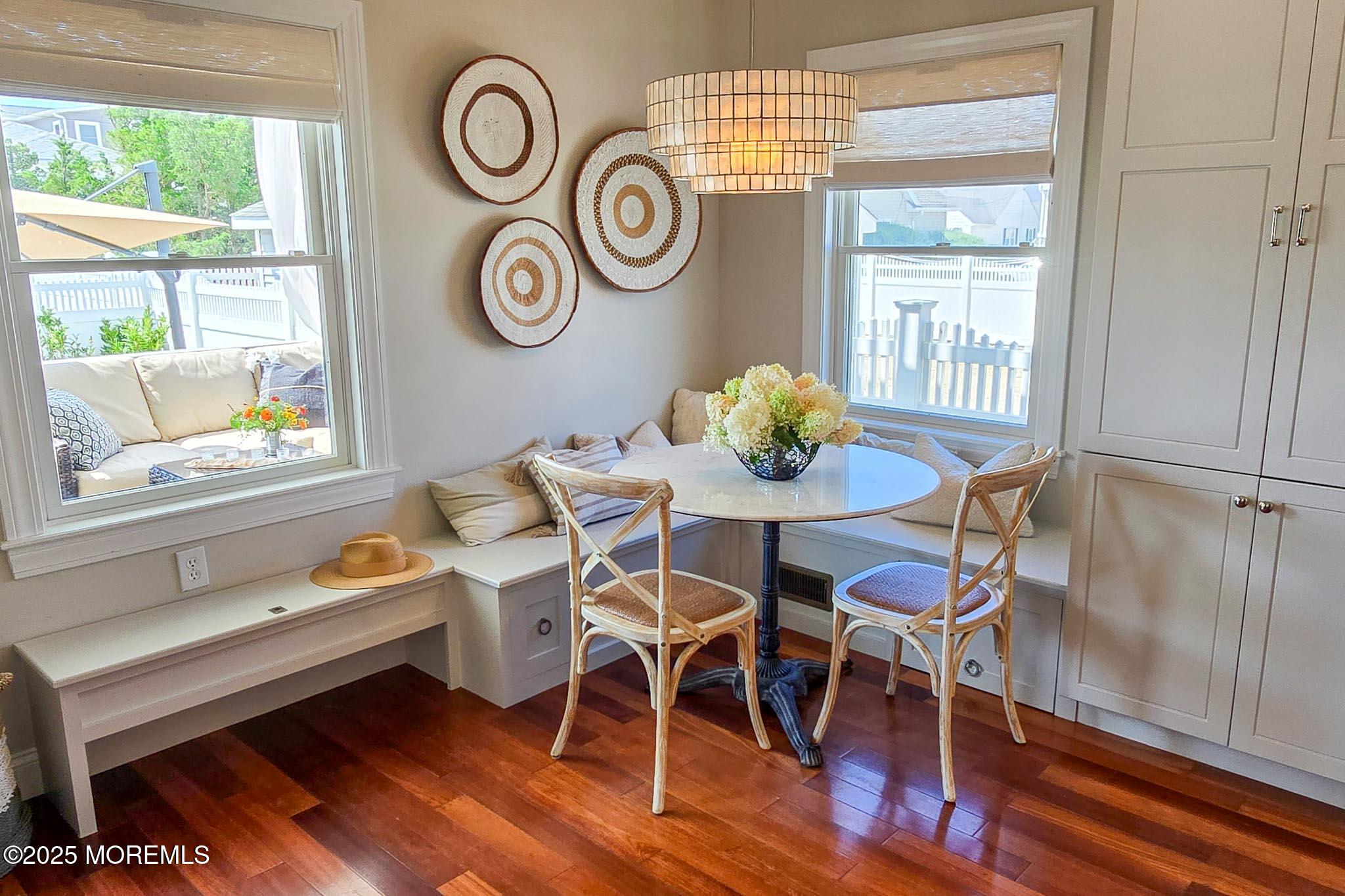 1604 Baltimore Avenue Lavallette, NJ 08735 - Photo 23 of 76 a dining room with furniture and wooden floor
