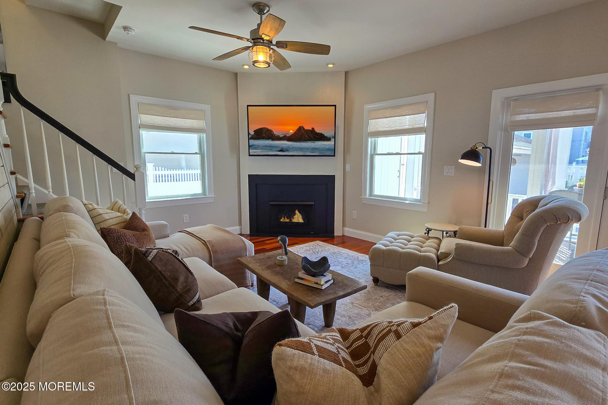 1604 Baltimore Avenue Lavallette, NJ 08735 - Photo 25 of 76 a living room with furniture a fireplace and a flat screen tv