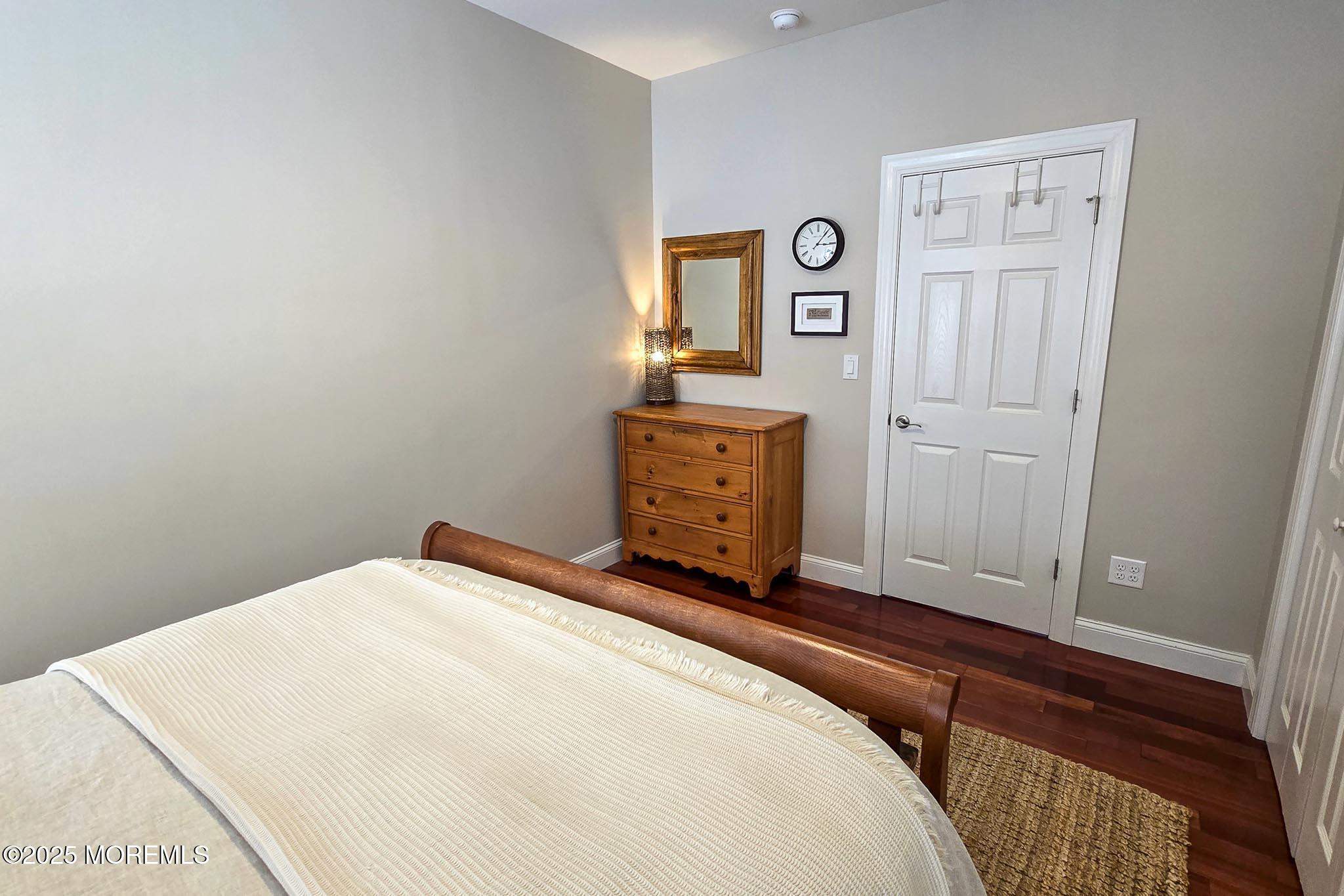 1604 Baltimore Avenue Lavallette, NJ 08735 - Photo 33 of 76 a bedroom with a bed and a dresser
