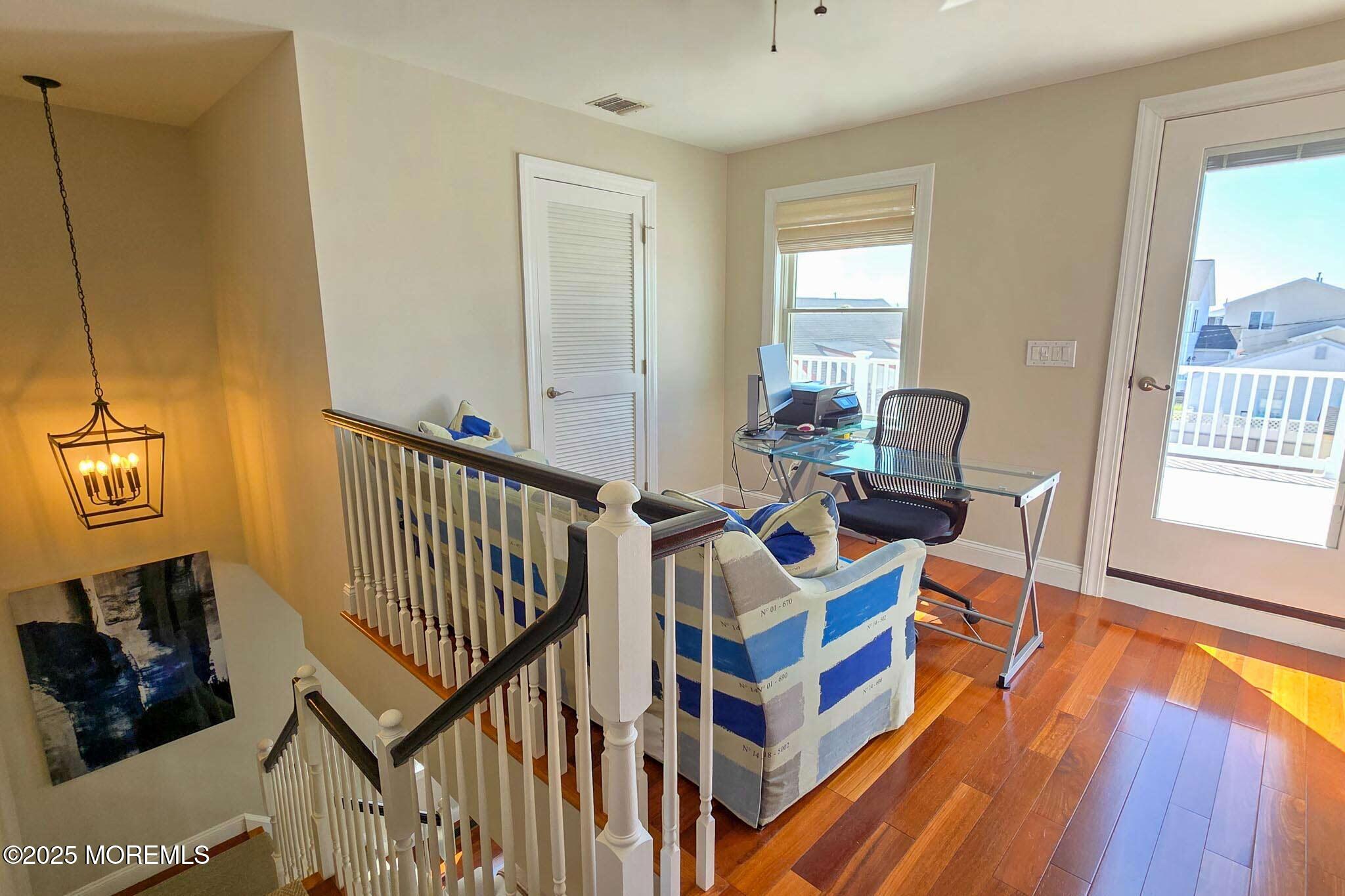 1604 Baltimore Avenue Lavallette, NJ 08735 - Photo 35 of 76 a view of a workspace with furniture and a window