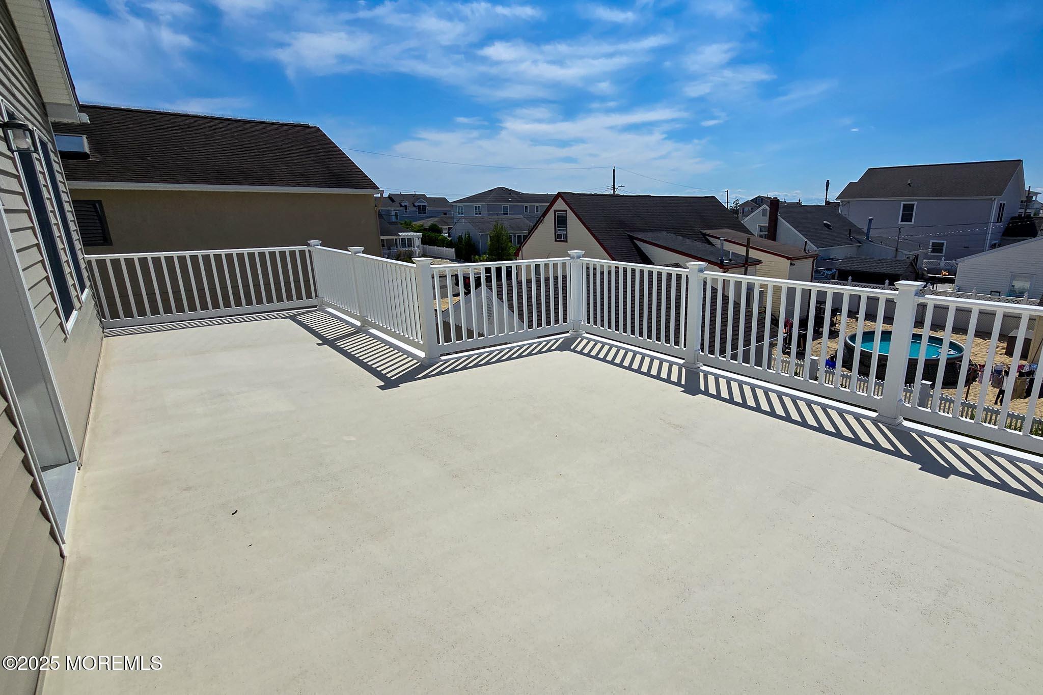 1604 Baltimore Avenue Lavallette, NJ 08735 - Photo 36 of 76 a view of balcony with wooden floor