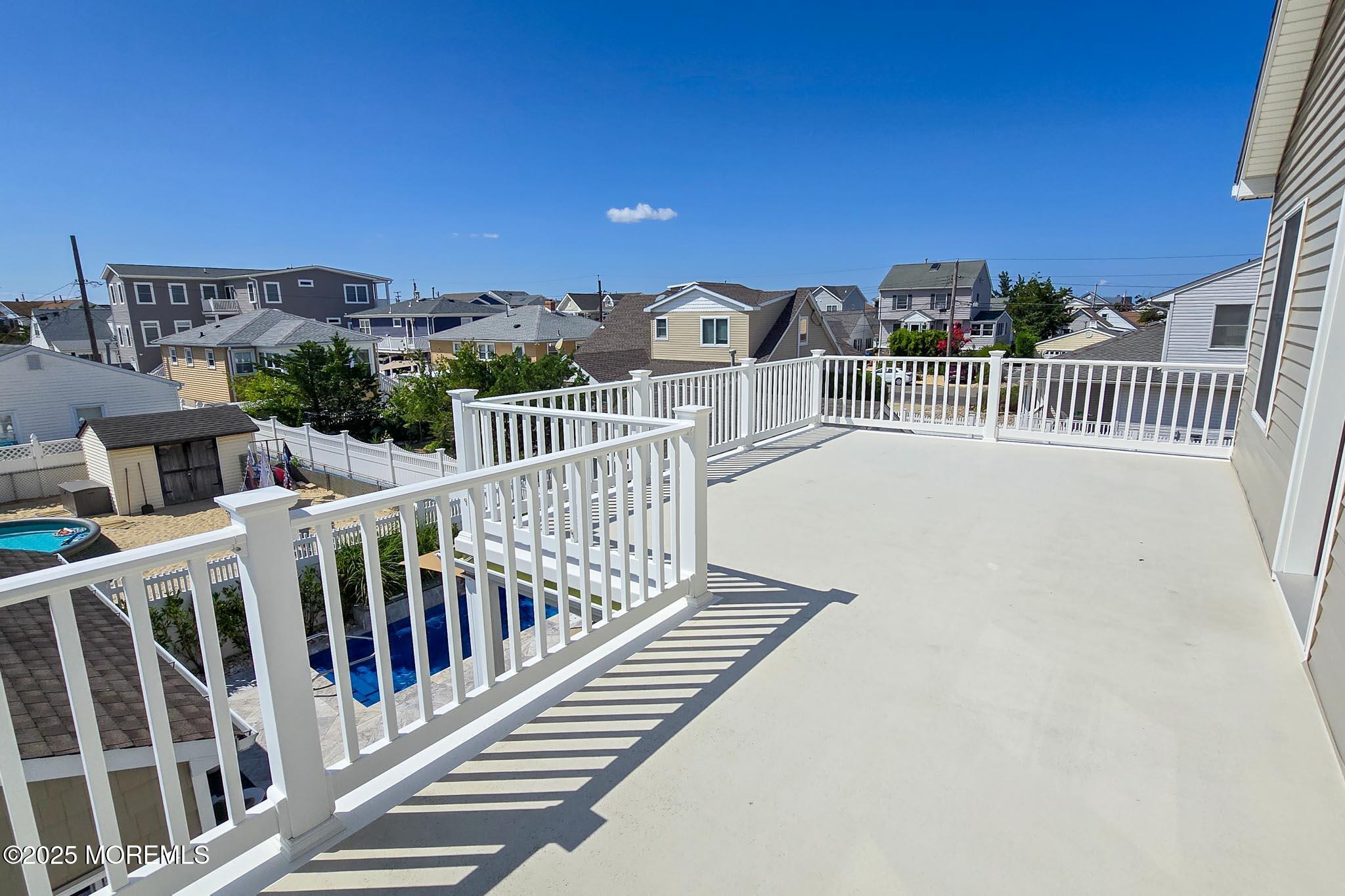 1604 Baltimore Avenue Lavallette, NJ 08735 - Photo 37 of 76 a view of a balcony with wooden floor