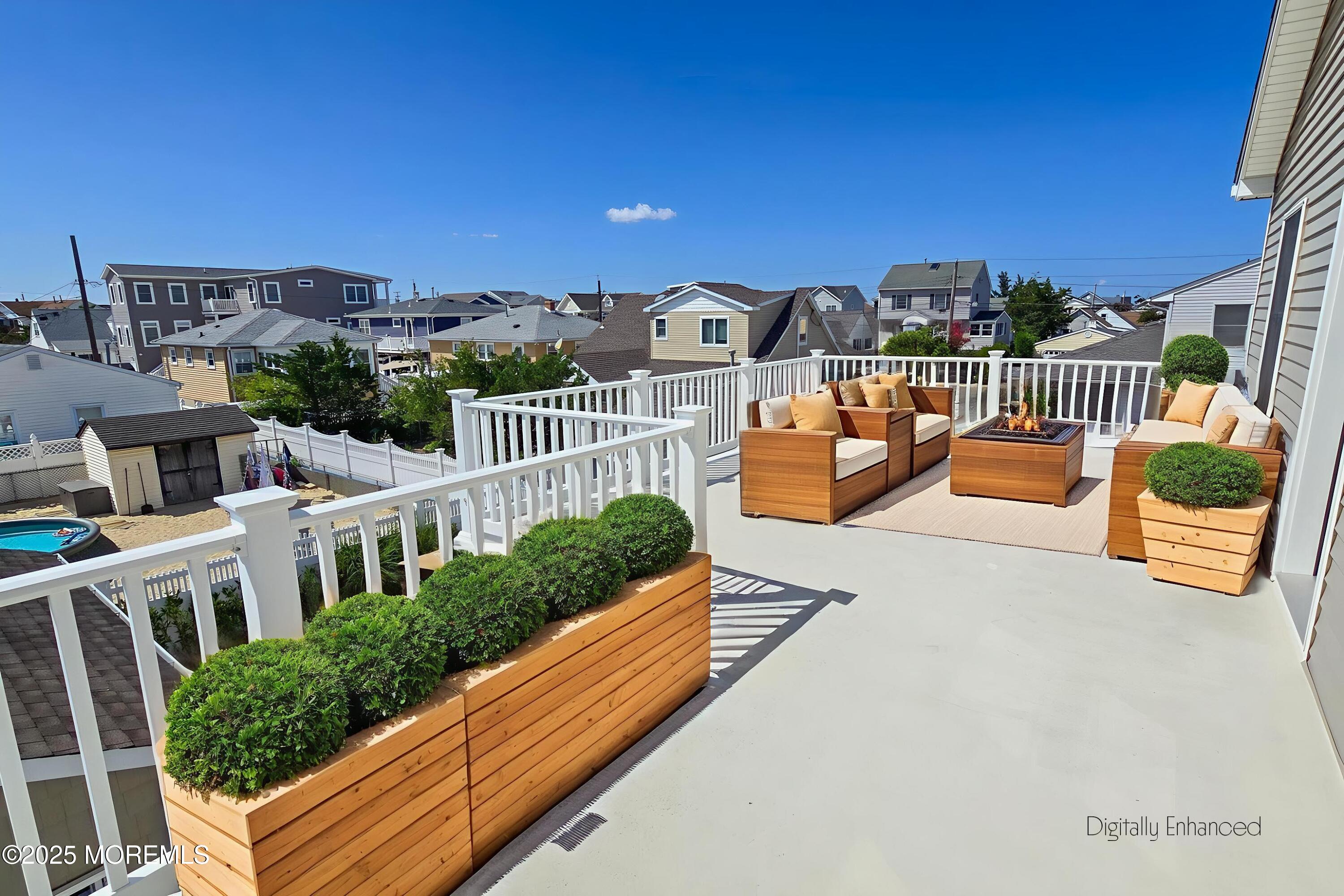 1604 Baltimore Avenue Lavallette, NJ 08735 - Photo 38 of 76 a balcony with couch and an outdoor seating