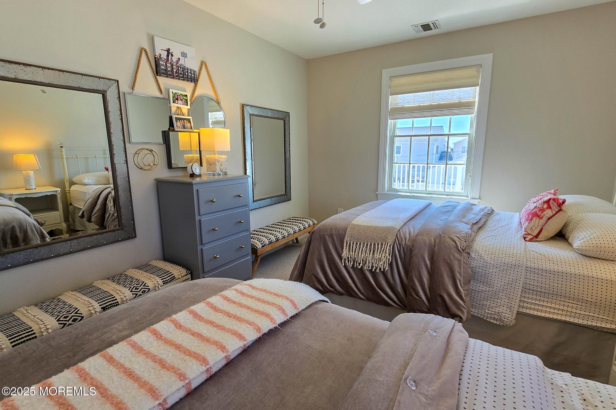 1604 Baltimore Avenue Lavallette, NJ 08735 - Photo 43 of 76 a bedroom with a bed and wooden floor