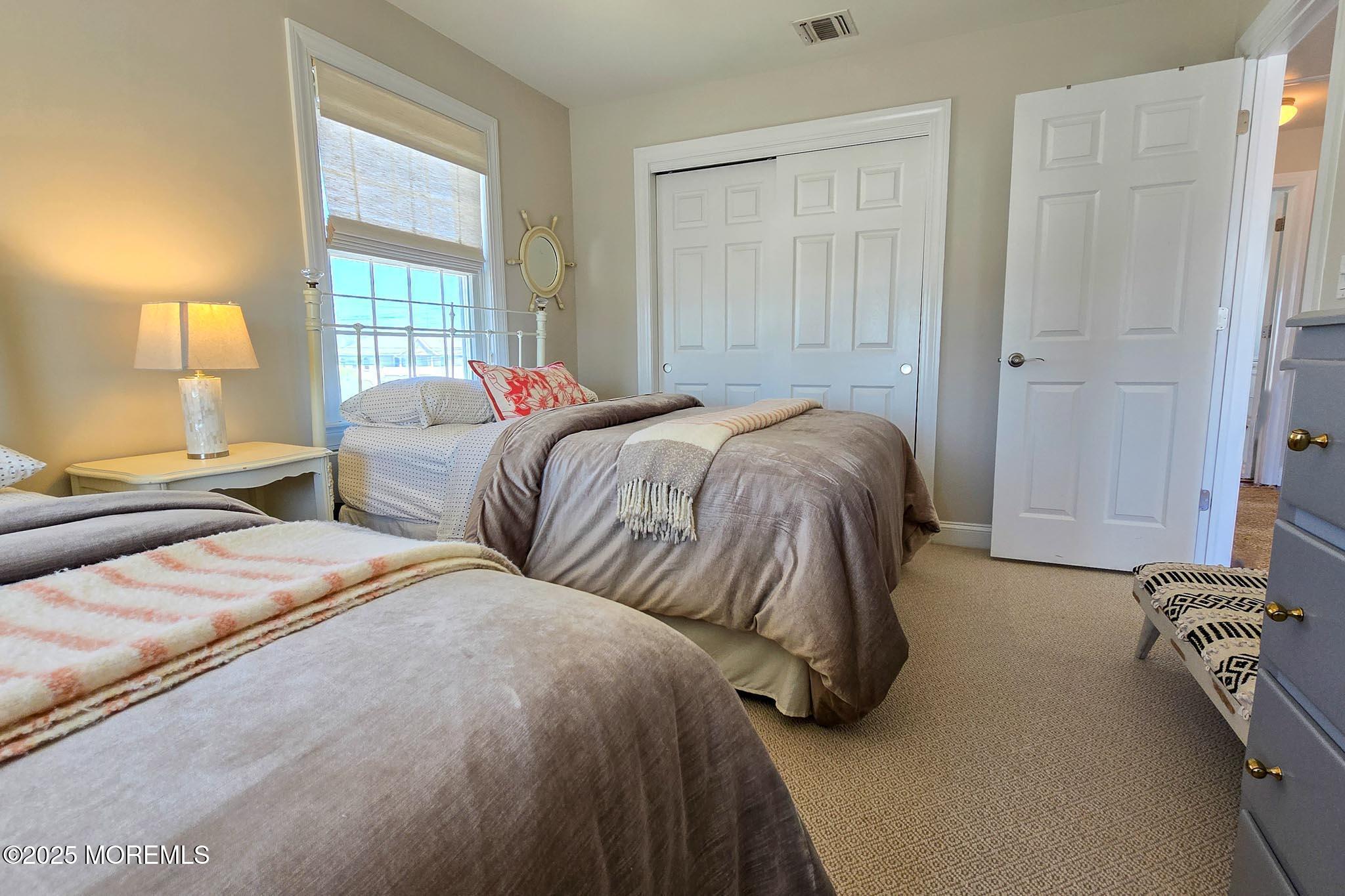 1604 Baltimore Avenue Lavallette, NJ 08735 - Photo 44 of 76 a bedroom with two bed and a window