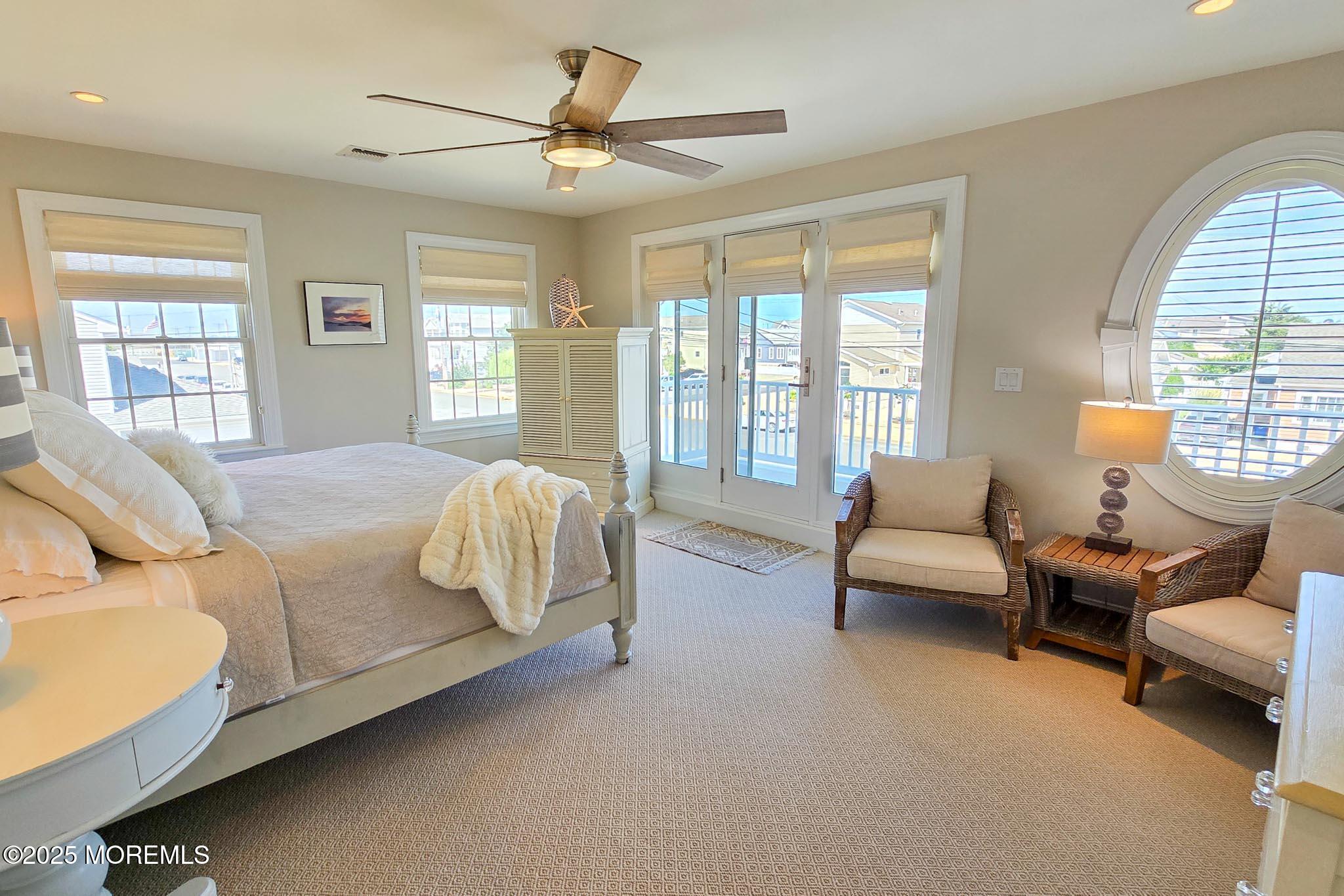 1604 Baltimore Avenue Lavallette, NJ 08735 - Photo 45 of 76 a spacious bedroom with a bed a couch and a large window