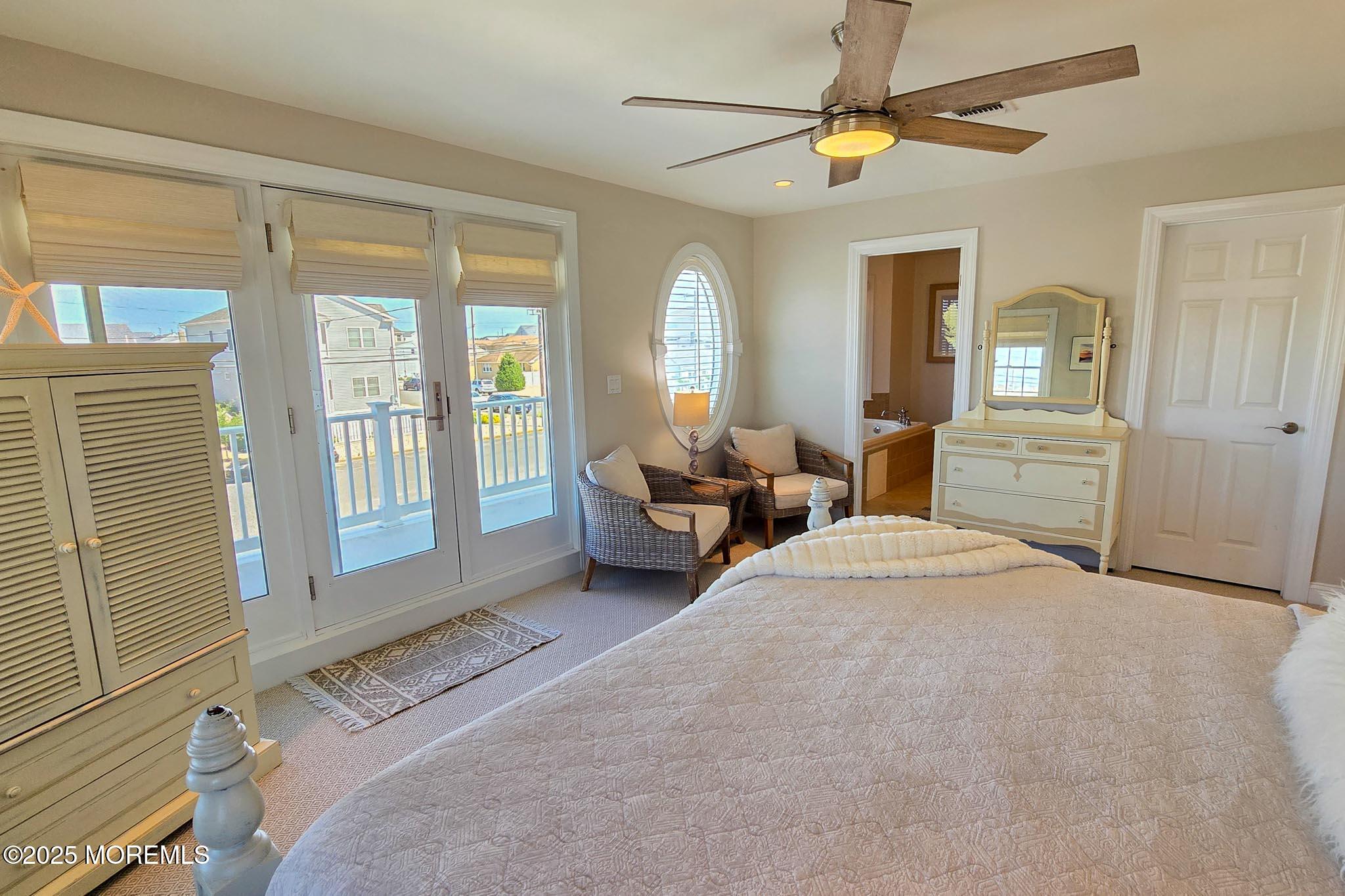 1604 Baltimore Avenue Lavallette, NJ 08735 - Photo 47 of 76 a bed room with a bed and a chandelier