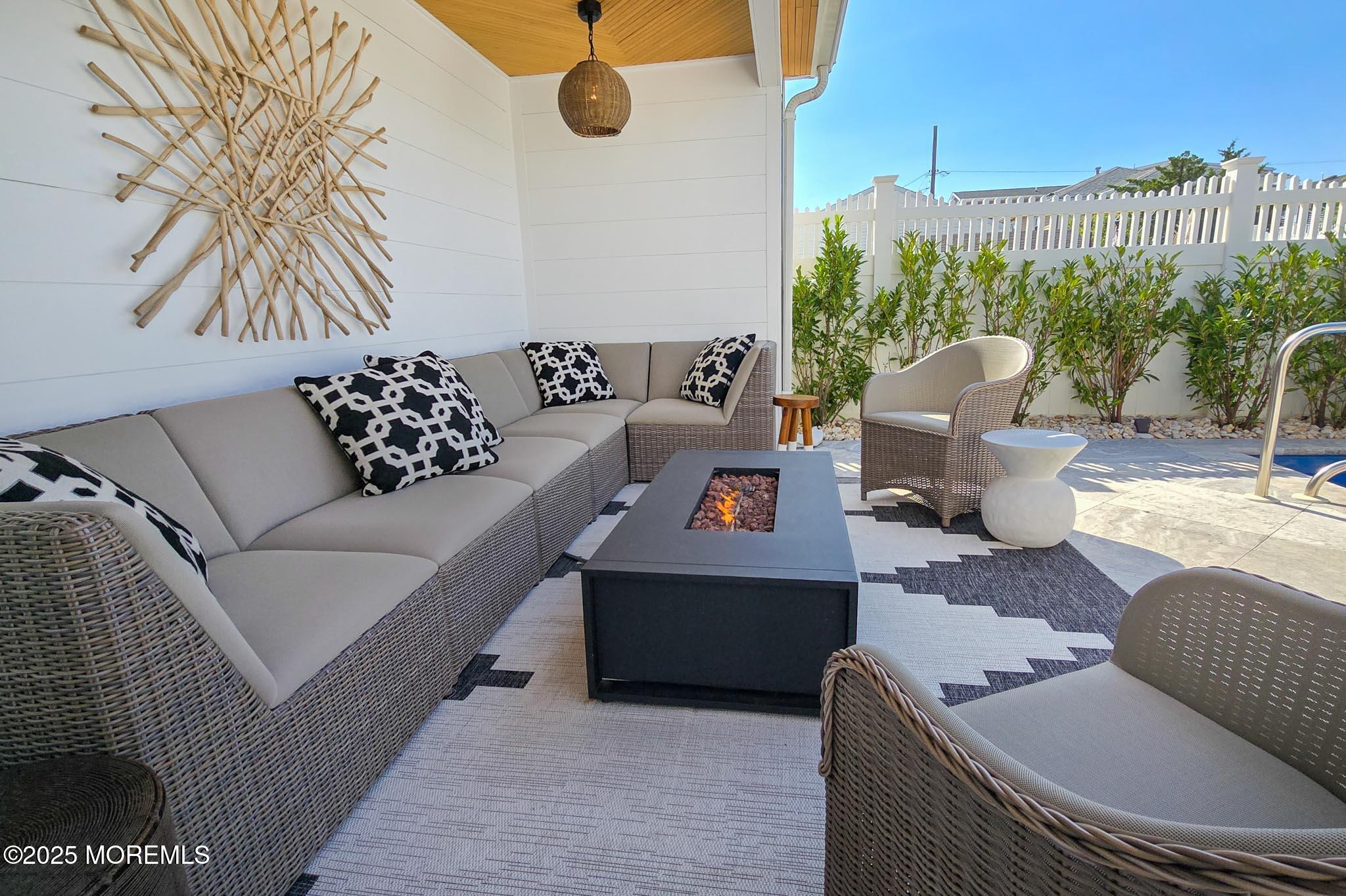 1604 Baltimore Avenue Lavallette, NJ 08735 - Photo 56 of 76 a living room with furniture and a potted plant