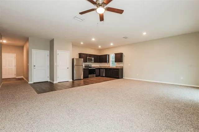 a view of kitchen and refrigerator
