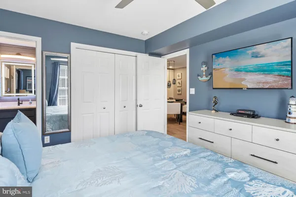 a room with a dresser and a flat screen tv