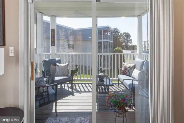 a balcony view with a seating space