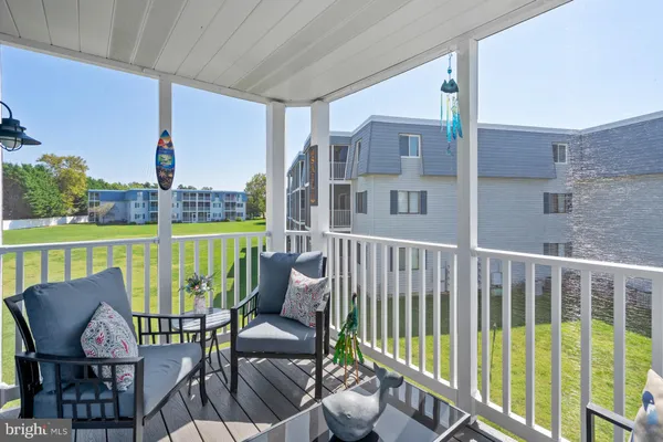 a view of a chairs and table in the patio