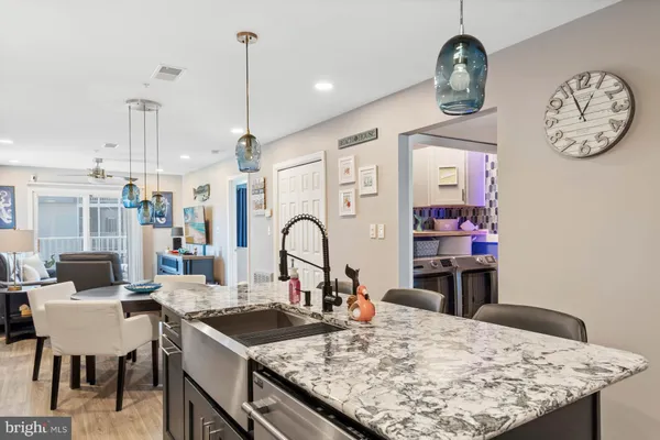 a kitchen with a table chairs and stove