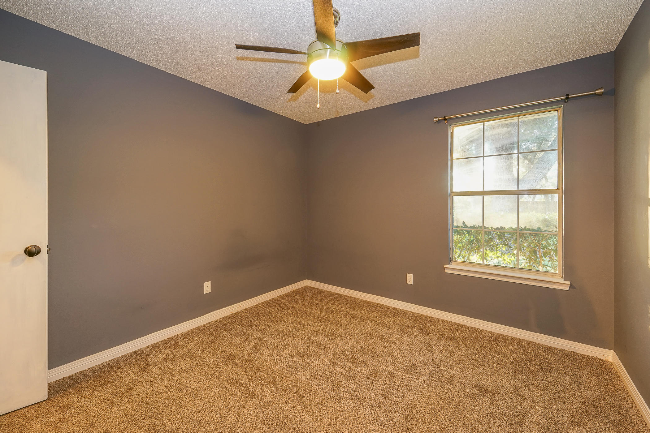7 Falcon Ridge Lane Fort Walton Beach, FL 32547 - Photo 14 of 25 an empty room with a window and a fan