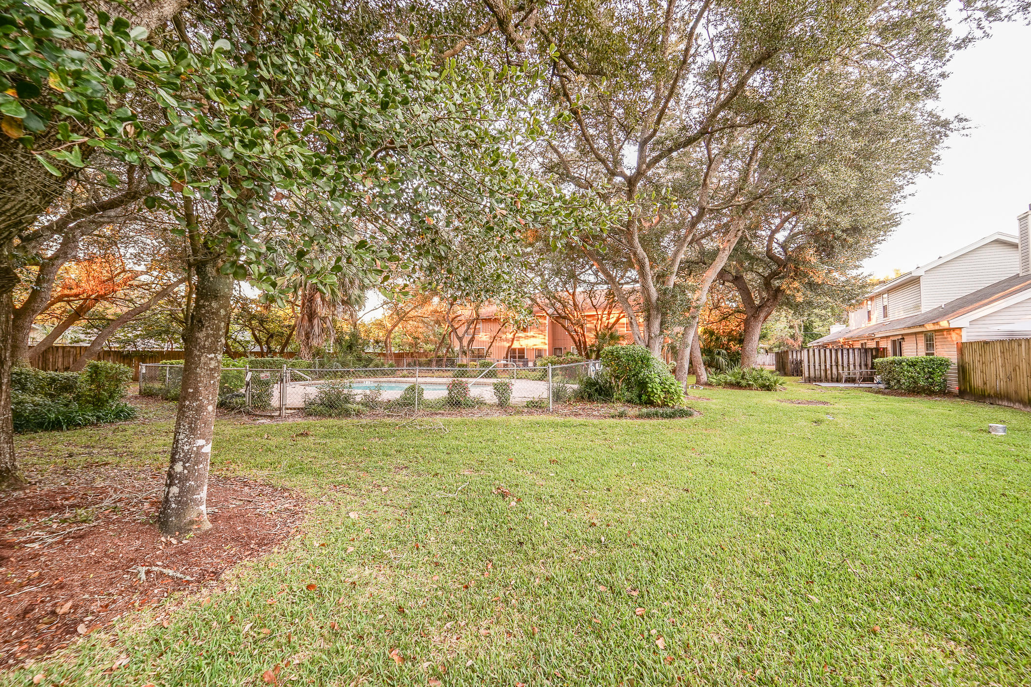 7 Falcon Ridge Lane Fort Walton Beach, FL 32547 - Photo 22 of 25 a backyard of a house with lots of green space