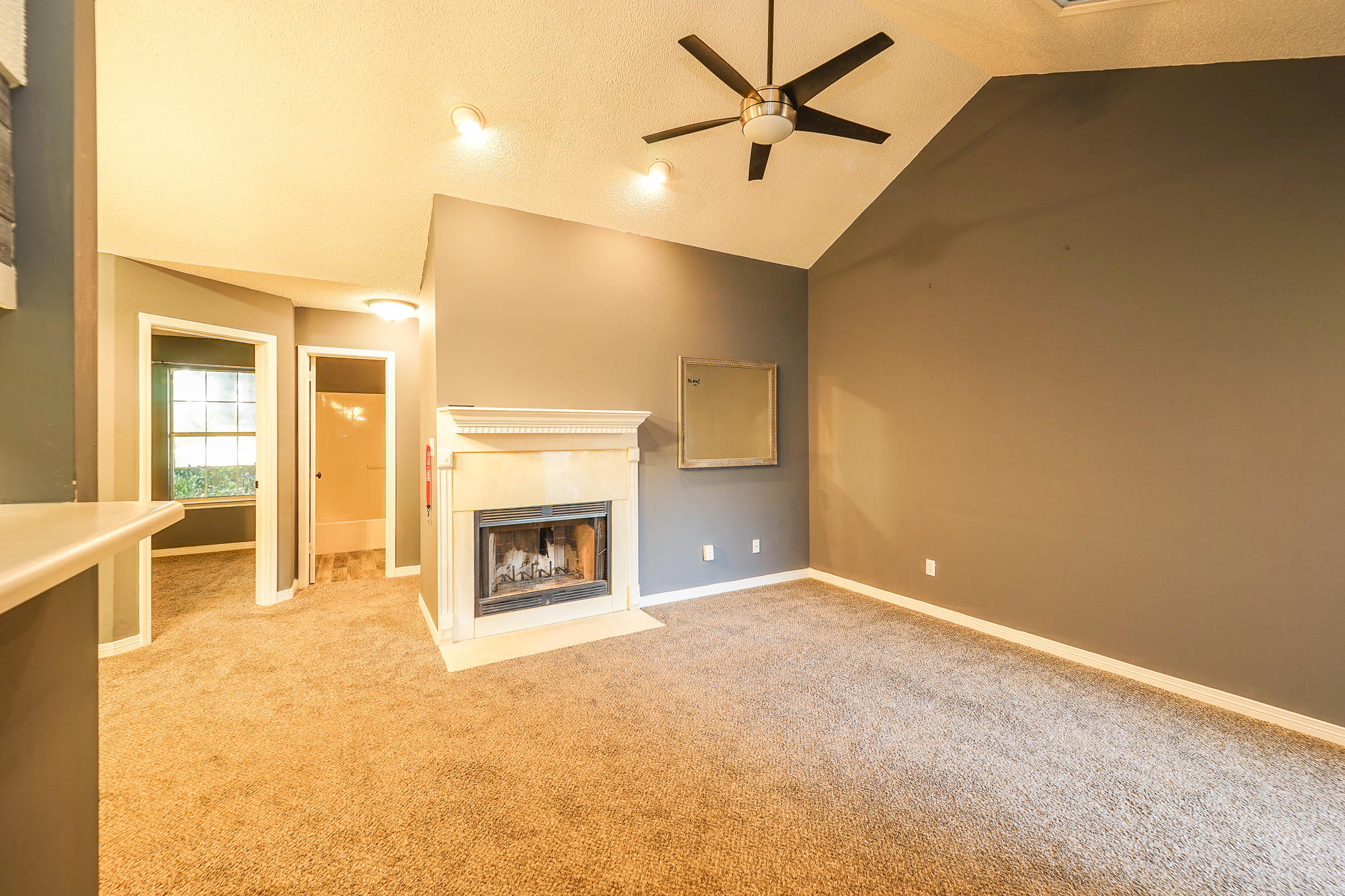 7 Falcon Ridge Lane Fort Walton Beach, FL 32547 - Photo 8 of 25 a view of an empty room with a fireplace and a window