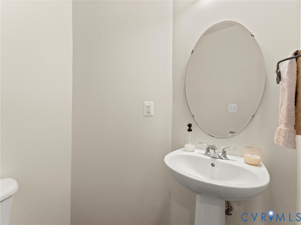 126 Reedy Creek Road Louisa, VA 23093 - Photo 21 of 68 Bathroom with a white pedestal sink, chrome faucet
