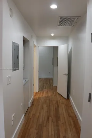 a bathroom with a toilet a sink and shower
