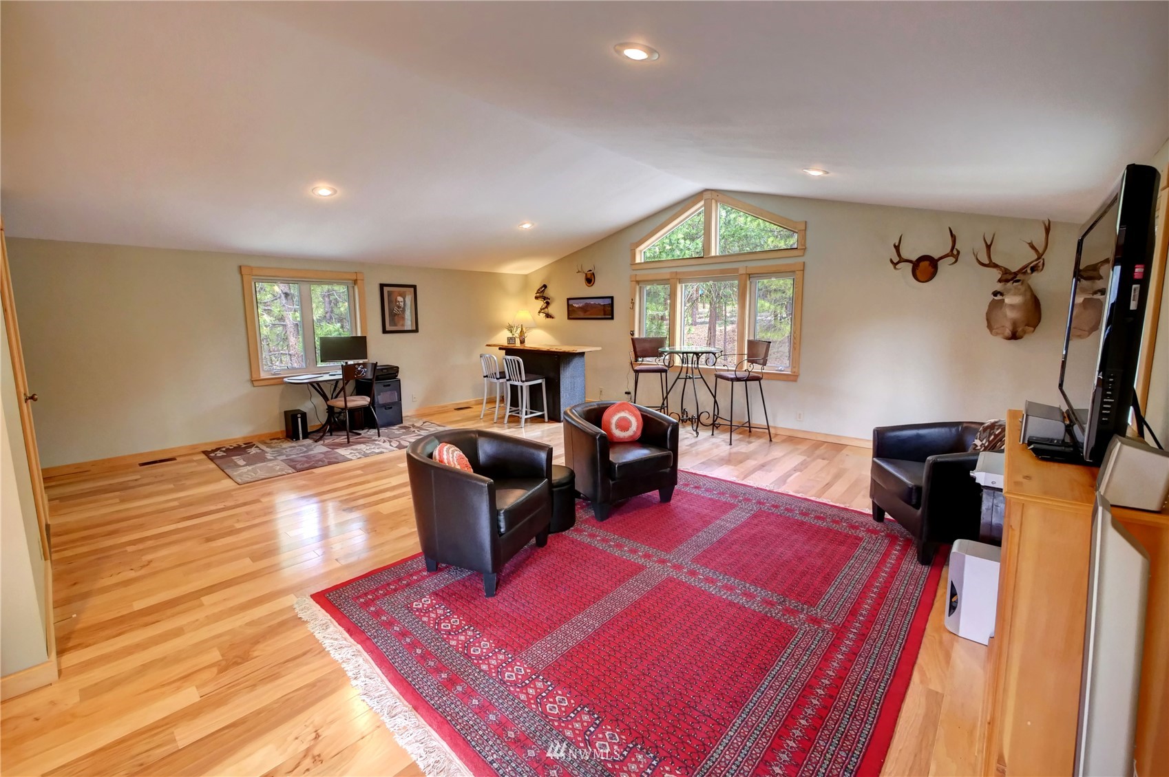 21 Bitterbrush Road Winthrop, WA 98862 - Photo 11 of 40 a living room with furniture fireplace and a window