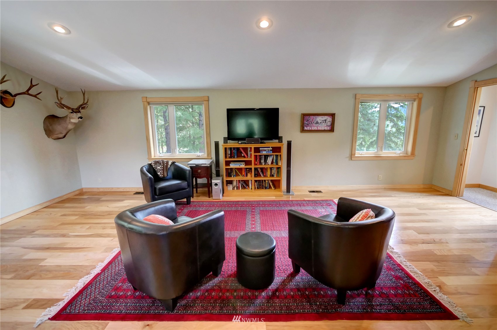 21 Bitterbrush Road Winthrop, WA 98862 - Photo 12 of 40 a room with furniture a flat screen tv and a window