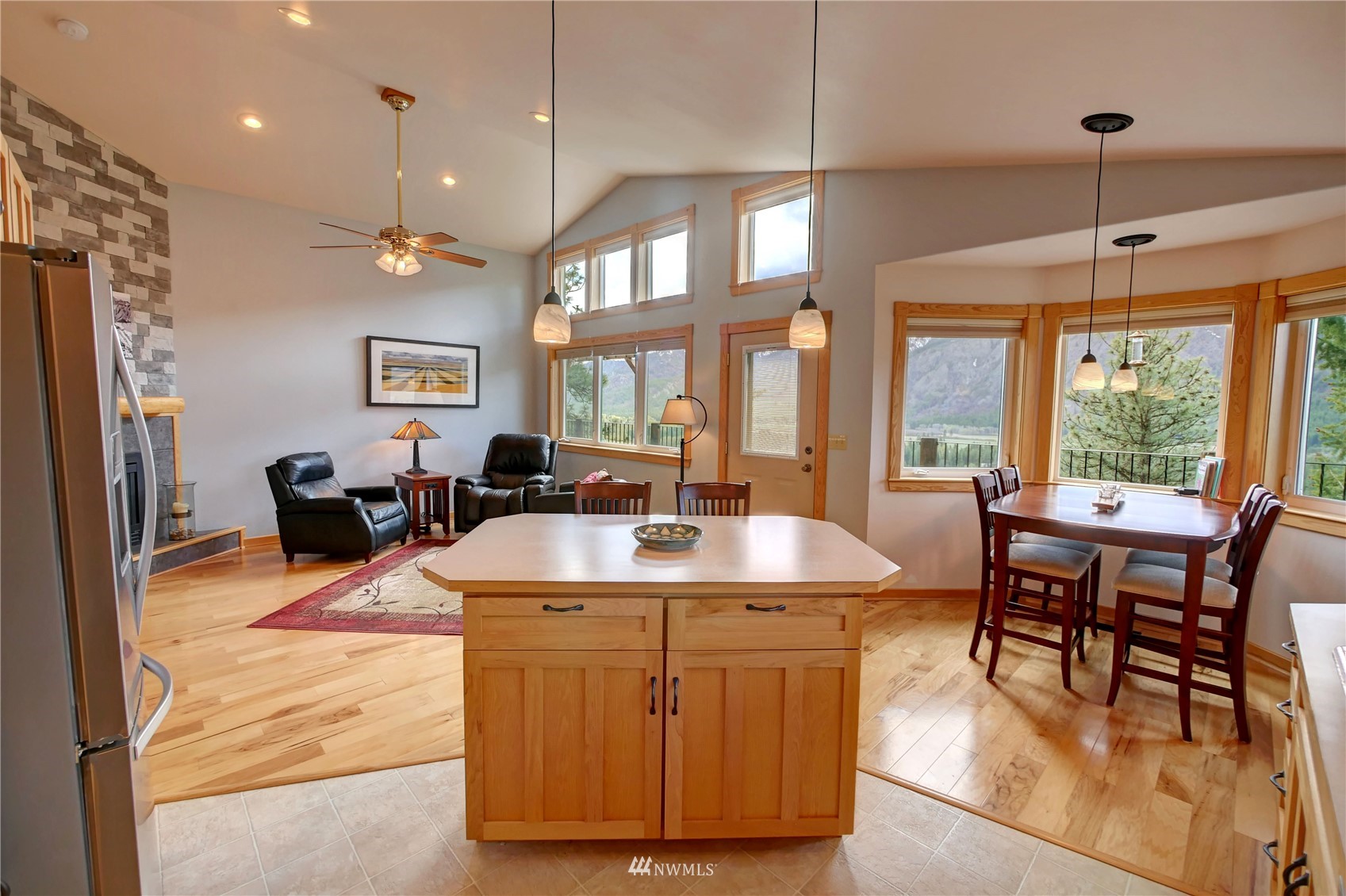 21 Bitterbrush Road Winthrop, WA 98862 - Photo 23 of 40 a view of a dining room with furniture a chandelier and wooden floor
