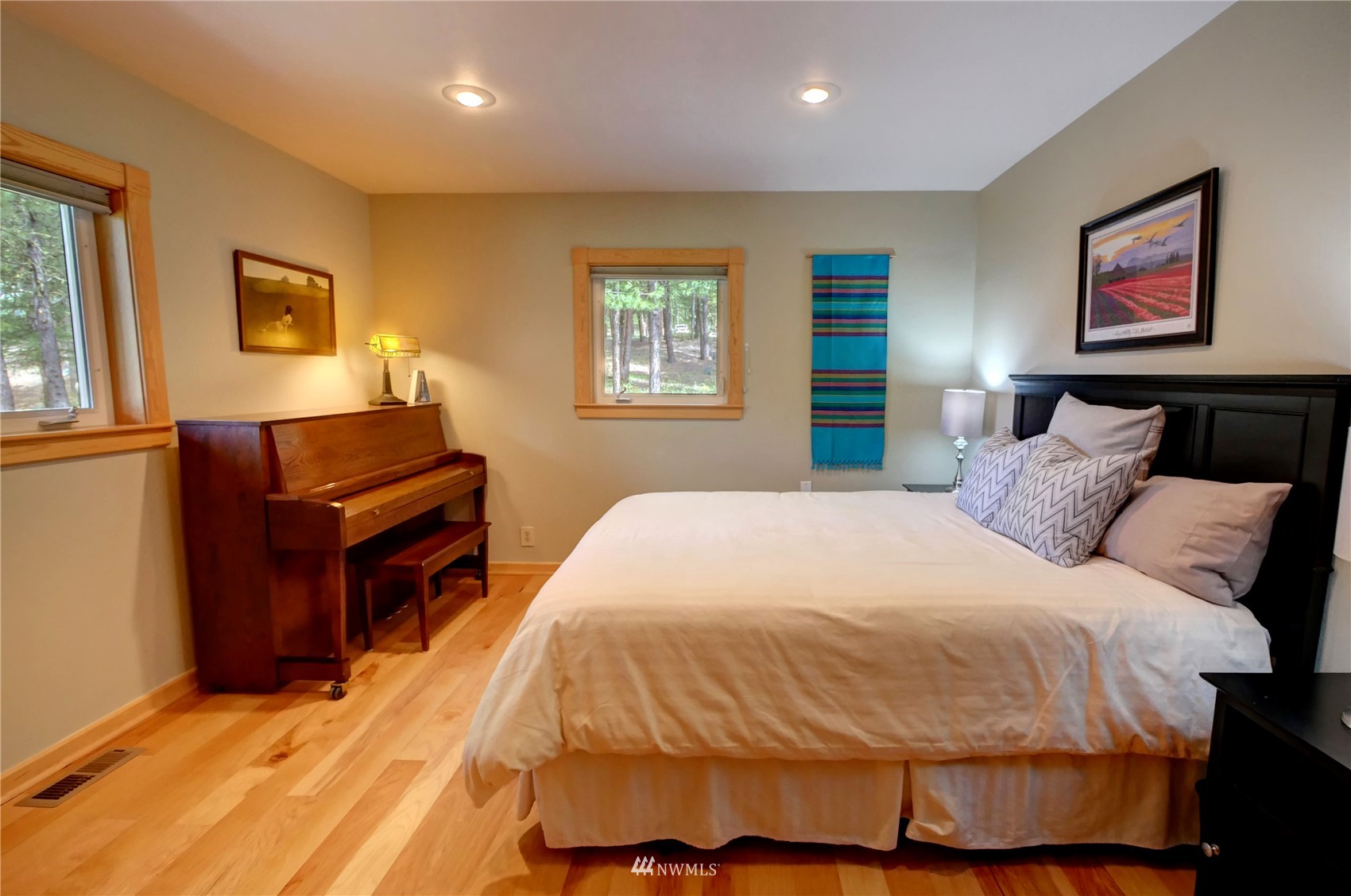 21 Bitterbrush Road Winthrop, WA 98862 - Photo 25 of 40 a bedroom with a bed and wooden floor
