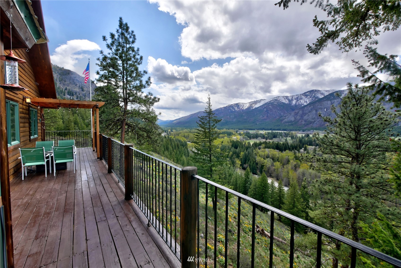 21 Bitterbrush Road Winthrop, WA 98862 - Photo 38 of 40 a balcony with wooden floor and city view