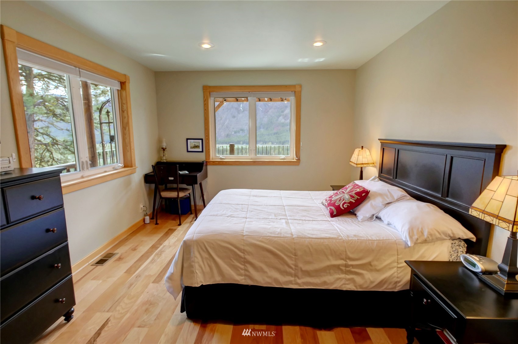 21 Bitterbrush Road Winthrop, WA 98862 - Photo 8 of 40 a bedroom with a bed and wooden floor
