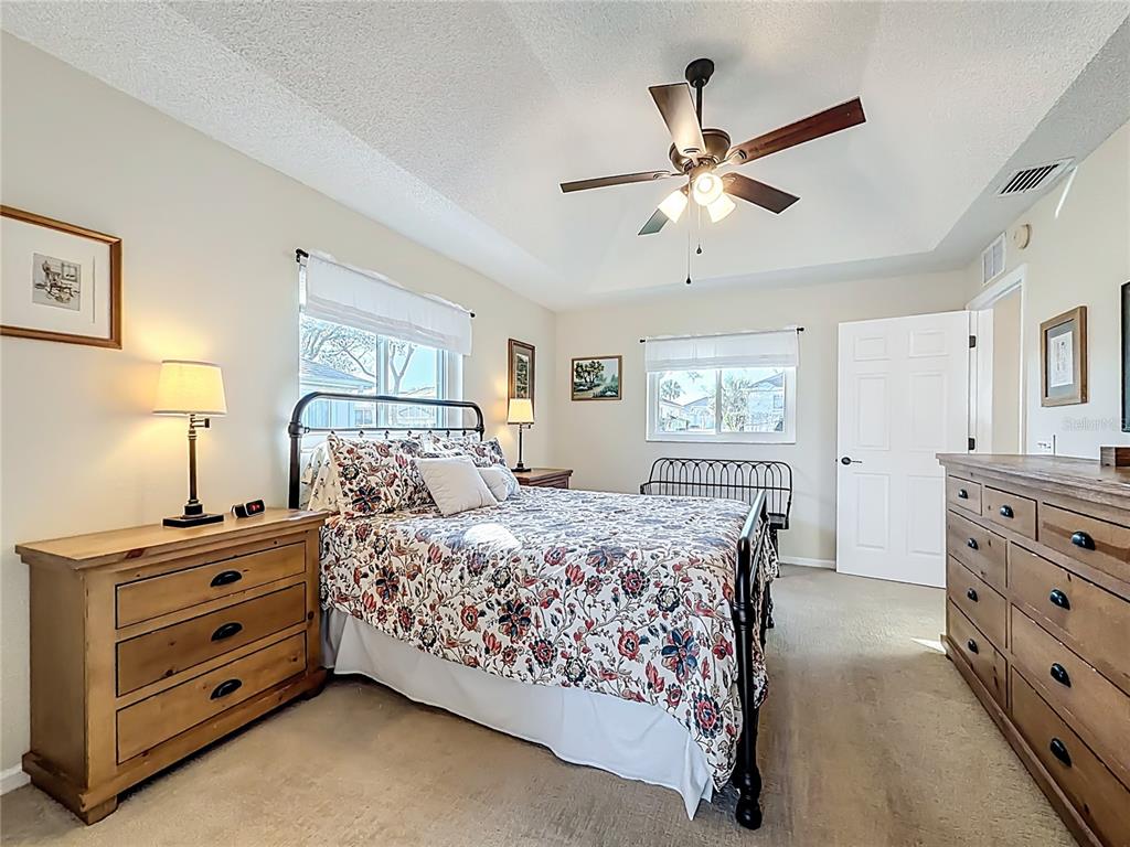 5226 Northwest 21st Loop Ocala, FL 34482 - Photo 18 of 57 a bedroom with a bed and a dresser