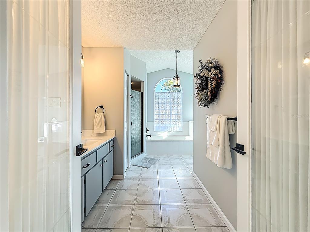 5226 Northwest 21st Loop Ocala, FL 34482 - Photo 20 of 57 a bathroom with a granite countertop shower