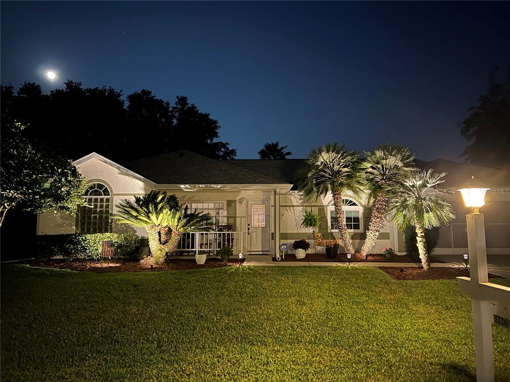 5226 Northwest 21st Loop Ocala, FL 34482 - Photo 2 of 57 a view of a house with a big yard